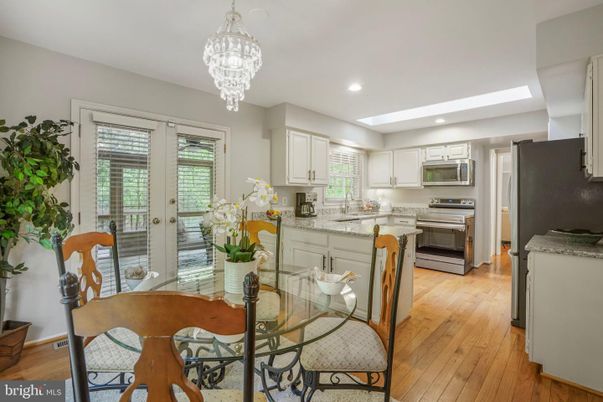 Chandelier, Dining room, Interior, Kitchen, Recessed Lighting, Stainless Steel Appliances, Wood Texture Flooring