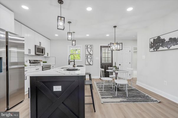 Dining room, Interior, Kitchen, Pendant Lights, Recessed Lighting, Stainless Steel Appliances, Wood Texture Flooring