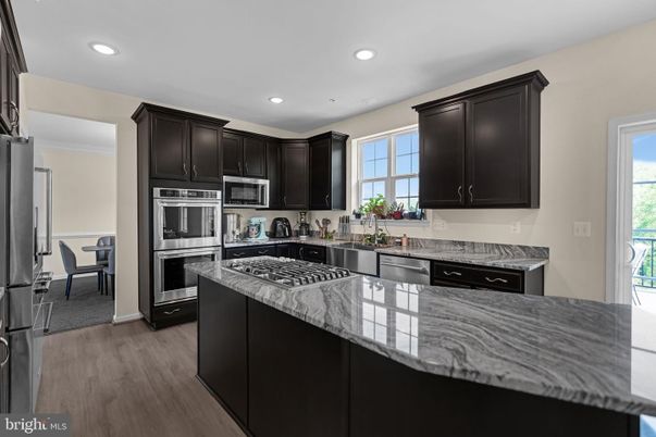 Dining room, Interior, Kitchen, Recessed Lighting, Stainless Steel Appliances, Wood Texture Flooring