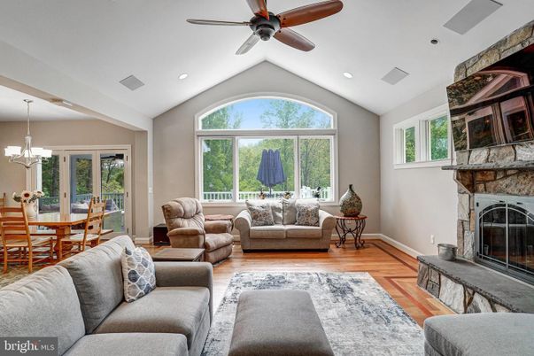 Chandelier, Dining room, Fireplace, Interior, Living room, Recessed Lighting, Wood Texture Flooring