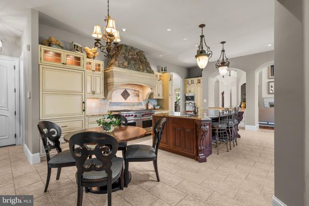 Chandelier, Dining room, Fireplace, Interior, Kitchen, Pendant Lights, Recessed Lighting, Stainless Steel Appliances