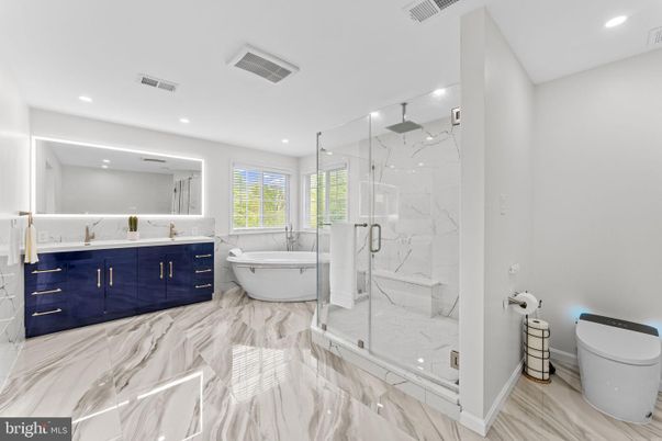 Bathroom, Dual Sink Vanities, Free Standing Baths, Glass Shower, Interior, Marble, Marble Walls, Recessed Lighting