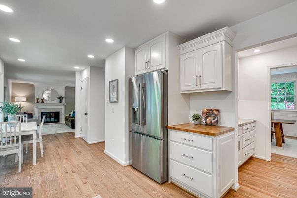 Dining room, Fireplace, Interior, Kitchen, Recessed Lighting, Stainless Steel Appliances, Wood Texture Flooring