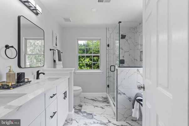 Bathroom, Dual Sink Vanities, Glass Shower, Interior, Marble, Marble Walls, Recessed Lighting