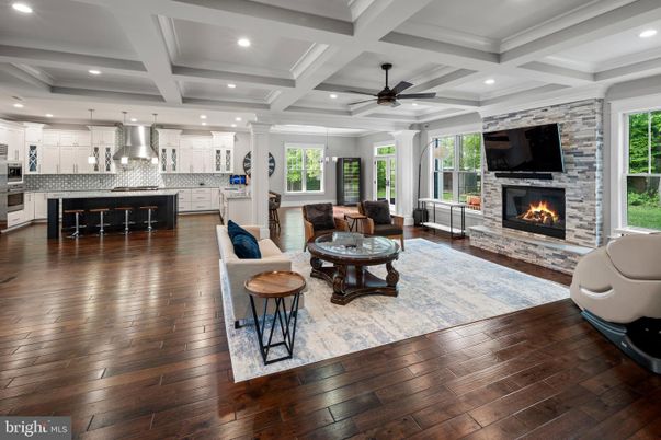 Fireplace, Interior, Kitchen, Living room, Recessed Lighting, Stainless Steel Appliances, Stone Walls, Wood Texture Flooring