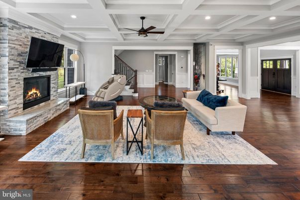 Fireplace, Interior, Living room, Recessed Lighting, Stone Walls, Wood Texture Flooring