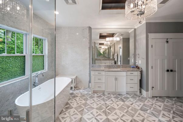 Bathroom, Chandelier, Dual Sink Vanities, Free Standing Baths, Glass Shower, Interior, Marble Walls, Recessed Lighting