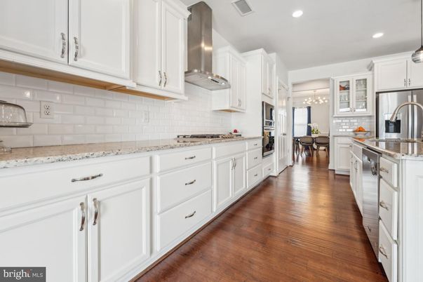 Chandelier, Dining room, Interior, Kitchen, Pendant Lights, Recessed Lighting, Stainless Steel Appliances, Wood Texture Flooring
