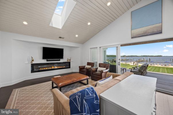Fireplace, Interior, Living room, Recessed Lighting, Water, Wood Texture Flooring