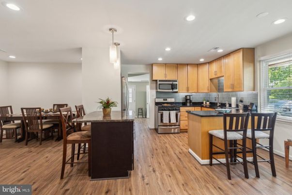 Dining room, Interior, Kitchen, Pendant Lights, Recessed Lighting, Stainless Steel Appliances, Wood Texture Flooring