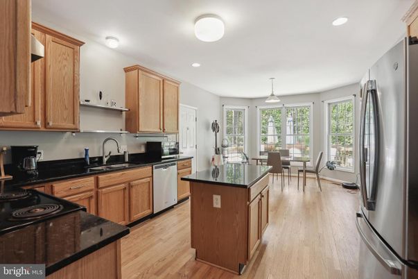 Dining room, Interior, Kitchen, Recessed Lighting, Stainless Steel Appliances, Wood Texture Flooring