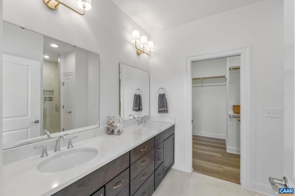 Bathroom, Dual Sink Vanities, Interior, Recessed Lighting, Walk-in Closets, Wood Texture Flooring