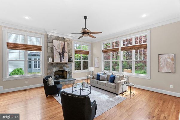 Fireplace, Interior, Living room, Recessed Lighting, Stone Walls, Wood Texture Flooring