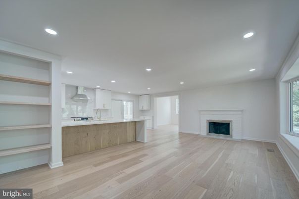 Empty room, Fireplace, Interior, Kitchen, Recessed Lighting, Wood Texture Flooring
