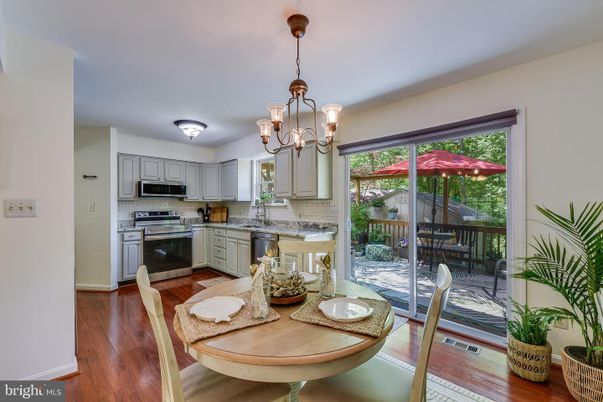 Chandelier, Dining room, Interior, Kitchen, Pendant Lights, Stainless Steel Appliances, Wood Texture Flooring