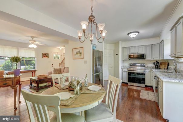 Chandelier, Dining room, Interior, Kitchen, Pendant Lights, Stainless Steel Appliances, Wood Texture Flooring