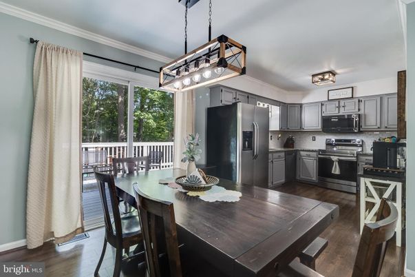 Dining room, Interior, Kitchen, Pendant Lights, Stainless Steel Appliances, Wood Texture Flooring