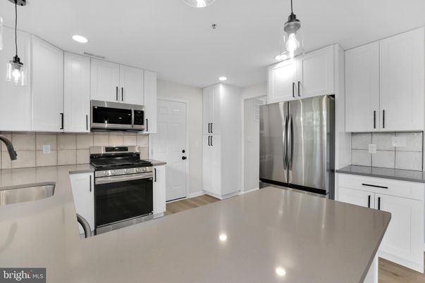 Interior, Kitchen, Pendant Lights, Recessed Lighting, Stainless Steel Appliances, Wood Texture Flooring