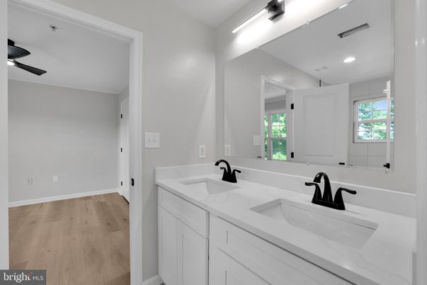 Bathroom, Dual Sink Vanities, Interior, Recessed Lighting, Wood Texture Flooring