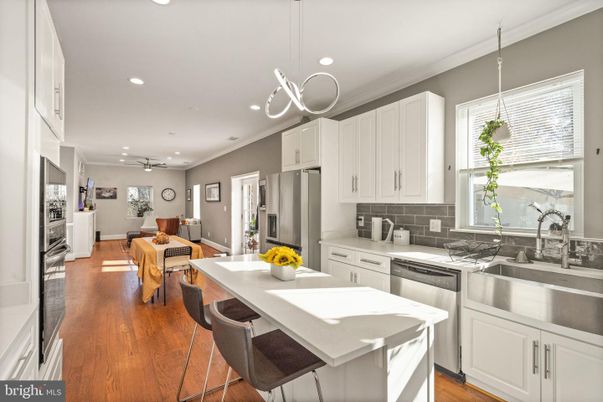 Dining room, Interior, Kitchen, Pendant Lights, Recessed Lighting, Stainless Steel Appliances, Wood Texture Flooring