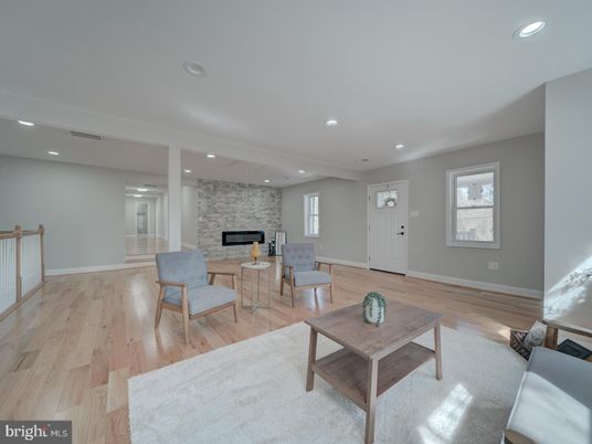 Fireplace, Interior, Living room, Recessed Lighting, Stone Walls, Wood Texture Flooring