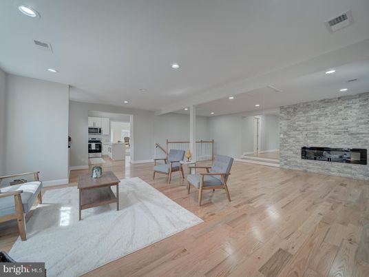 Fireplace, Interior, Kitchen, Recessed Lighting, Stainless Steel Appliances, Stone Walls, Wood Texture Flooring