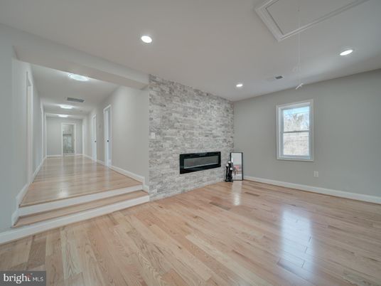 Empty room, Fireplace, Interior, Recessed Lighting, Stone Walls, Wood Texture Flooring