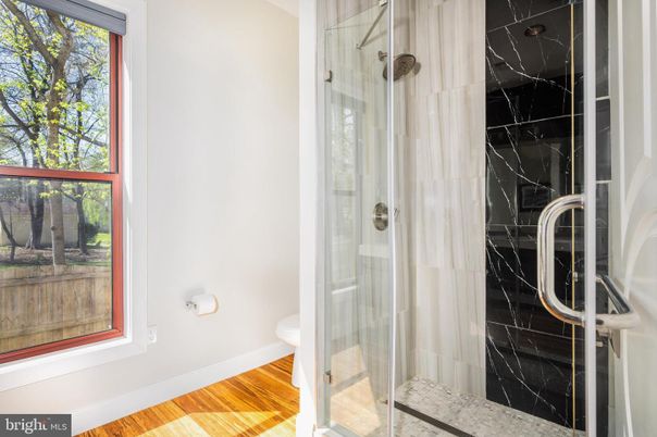 Bathroom, Glass Shower, Interior, Marble Walls, Wood Texture Flooring