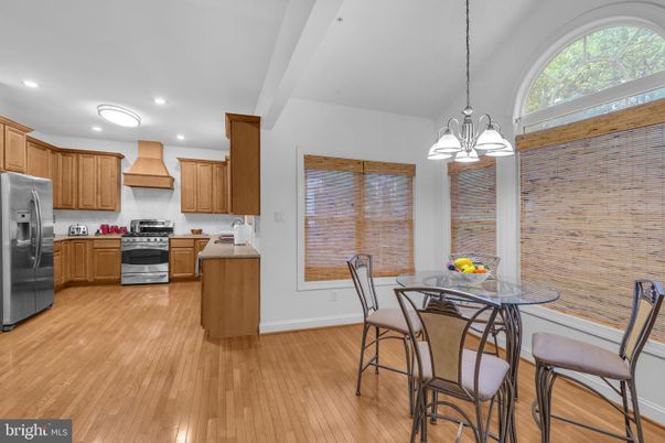 Dining room, Interior, Kitchen, Pendant Lights, Recessed Lighting, Stainless Steel Appliances, Wood Texture Flooring