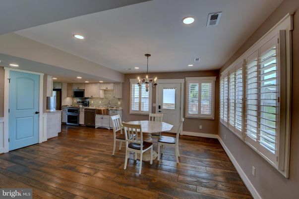 Chandelier, Dining room, Interior, Kitchen, Pendant Lights, Recessed Lighting, Stainless Steel Appliances, Wood Texture Flooring