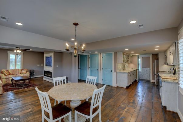 Chandelier, Dining room, Fireplace, Interior, Kitchen, Living room, Recessed Lighting, Wood Texture Flooring