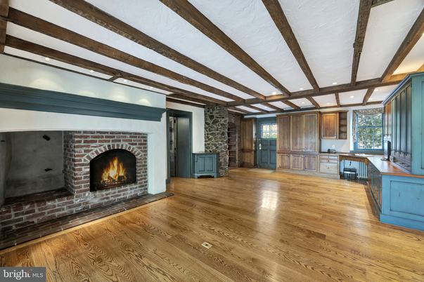 Empty room, Fireplace, Interior, Recessed Lighting, Stone Walls, Wooden Beams, Wood Texture Flooring