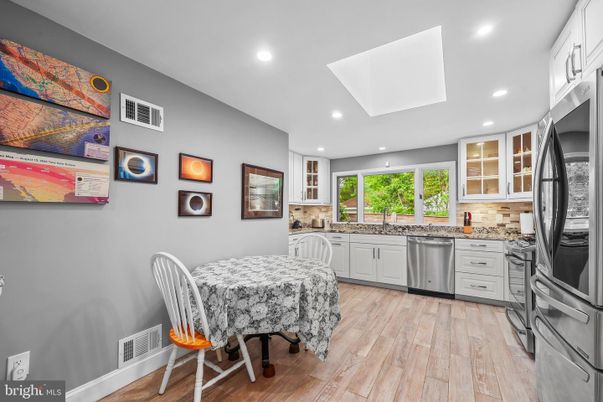 Dining room, Interior, Kitchen, Recessed Lighting, Stainless Steel Appliances, Wood Texture Flooring
