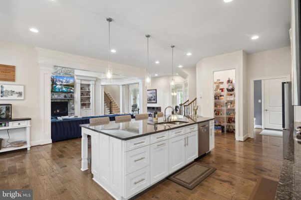 Fireplace, Interior, Kitchen, Living room, Pendant Lights, Recessed Lighting, Stainless Steel Appliances, Wood Texture Flooring