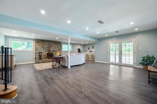 Fireplace, Interior, Living room, Recessed Lighting, Stone Walls, Wood Texture Flooring