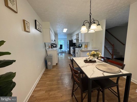 Chandelier, Dining room, Interior, Kitchen, Stainless Steel Appliances, Wood Texture Flooring