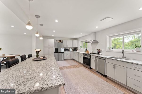 Dining room, Interior, Kitchen, Pendant Lights, Recessed Lighting, Stainless Steel Appliances, Wood Texture Flooring