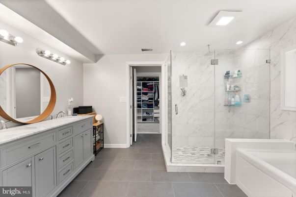 Bathroom, Dual Sink Vanities, Glass Shower, Interior, Marble Walls, Recessed Lighting, Walk-in Closets
