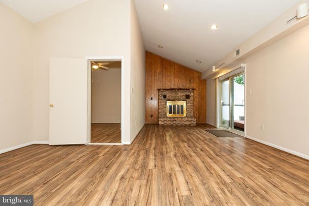 Empty room, Fireplace, Interior, Recessed Lighting, Wood Texture Flooring, Wooden Walls