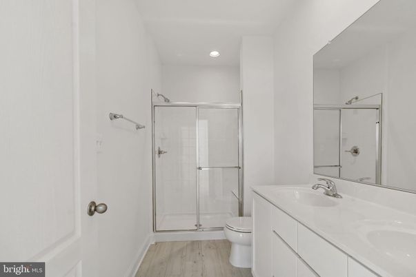 Bathroom, Dual Sink Vanities, Glass Shower, Interior, Recessed Lighting, Wood Texture Flooring
