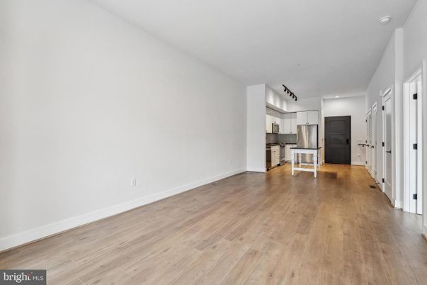 Empty room, Interior, Kitchen, Stainless Steel Appliances, Wood Texture Flooring