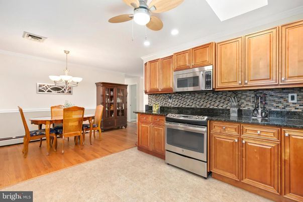 Chandelier, Dining room, Interior, Kitchen, Recessed Lighting, Stainless Steel Appliances, Wood Texture Flooring