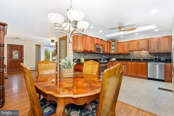 Chandelier, Dining room, Interior, Kitchen, Recessed Lighting, Stainless Steel Appliances, Wood Texture Flooring