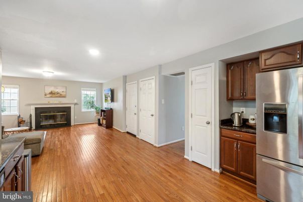 Fireplace, Interior, Kitchen, Recessed Lighting, Stainless Steel Appliances, Wood Texture Flooring