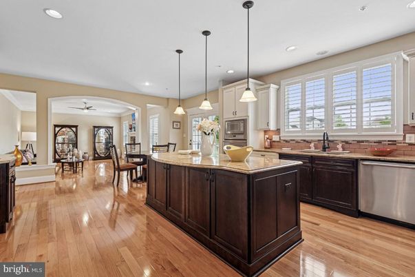 Dining room, Interior, Kitchen, Pendant Lights, Recessed Lighting, Stainless Steel Appliances, Wood Texture Flooring