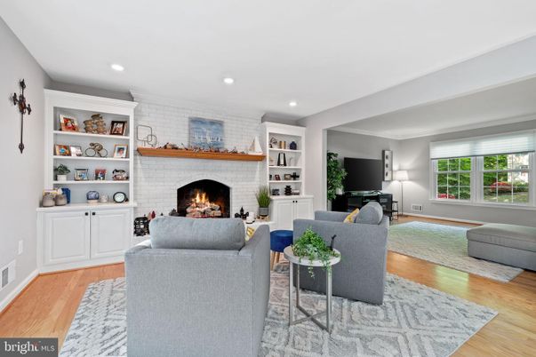 Fireplace, Interior, Living room, Recessed Lighting, Stone Walls, Wood Texture Flooring