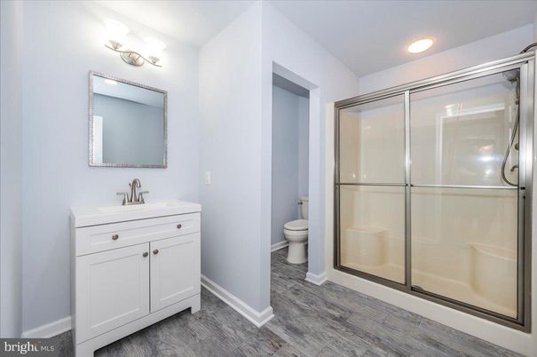Bathroom, Glass Shower, Interior, Recessed Lighting, Wood Texture Flooring