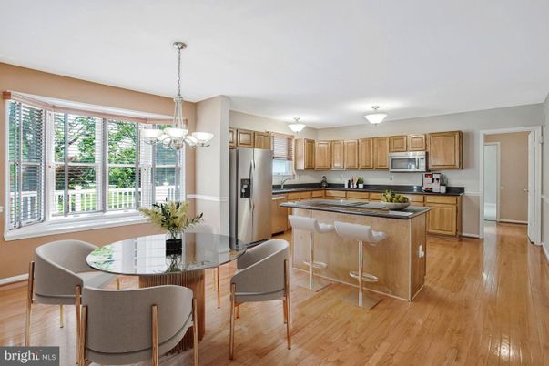 Chandelier, Dining room, Interior, Kitchen, Pendant Lights, Stainless Steel Appliances, Wood Texture Flooring