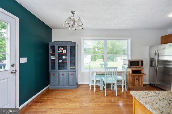 Chandelier, Dining room, Interior, Kitchen, Stainless Steel Appliances, Wood Texture Flooring