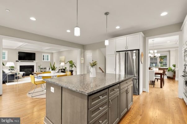 Chandelier, Dining room, Fireplace, Interior, Kitchen, Living room, Pendant Lights, Recessed Lighting, Stainless Steel Appliances, Wood Texture Flooring